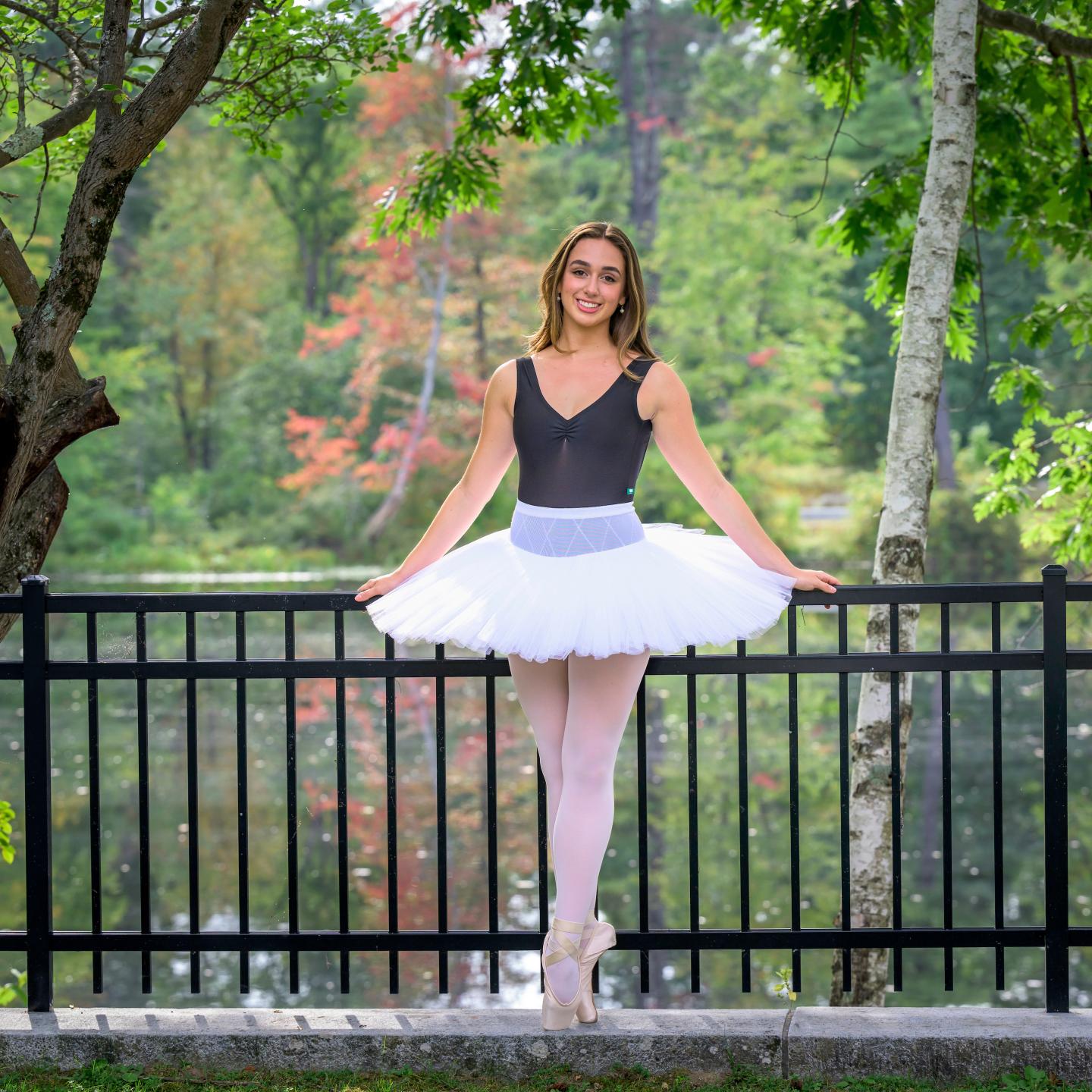 Cristina Baron posing in dance outfit in front of Sheldon