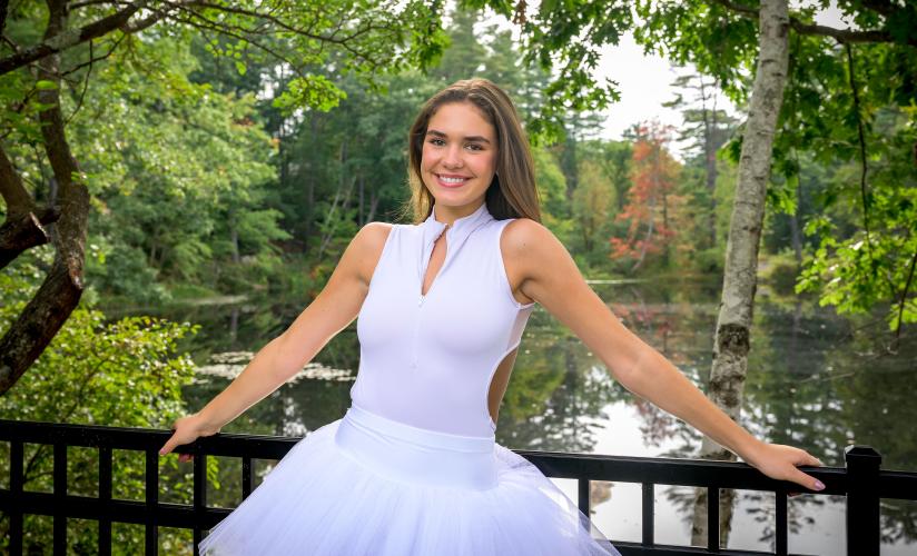 Lulu Mangriotis '25 in ballet outfit in front of Sheldon Pond