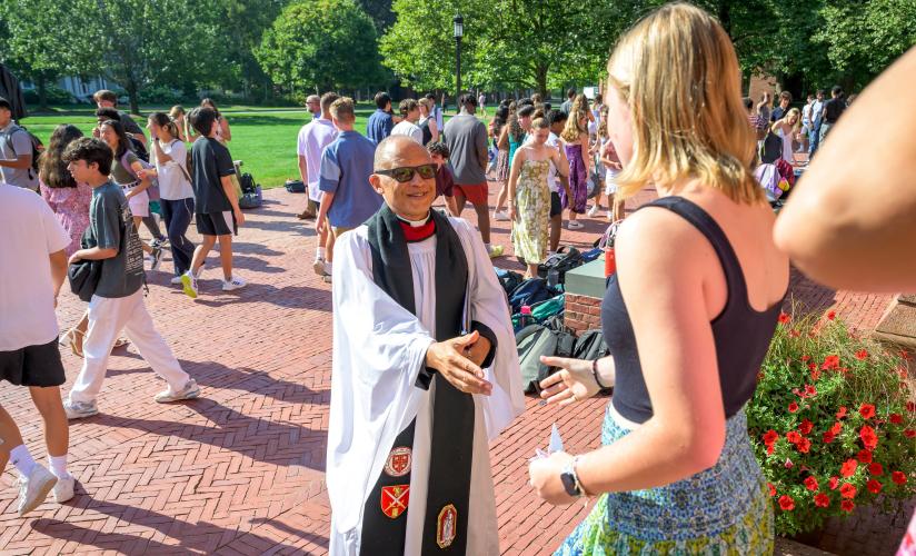 SPS Dean of Chapel and Spiritual Life Rev. Charles Wynder Jr greets students as they exit morning chapel after Fall Convocation.