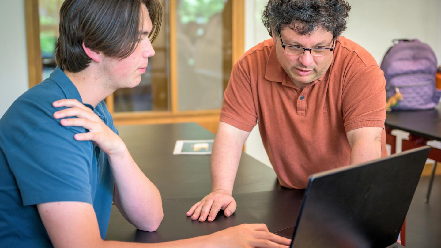 Chris Morse with student in class